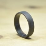 Shaped wooden ring that needs finishing coat and polish