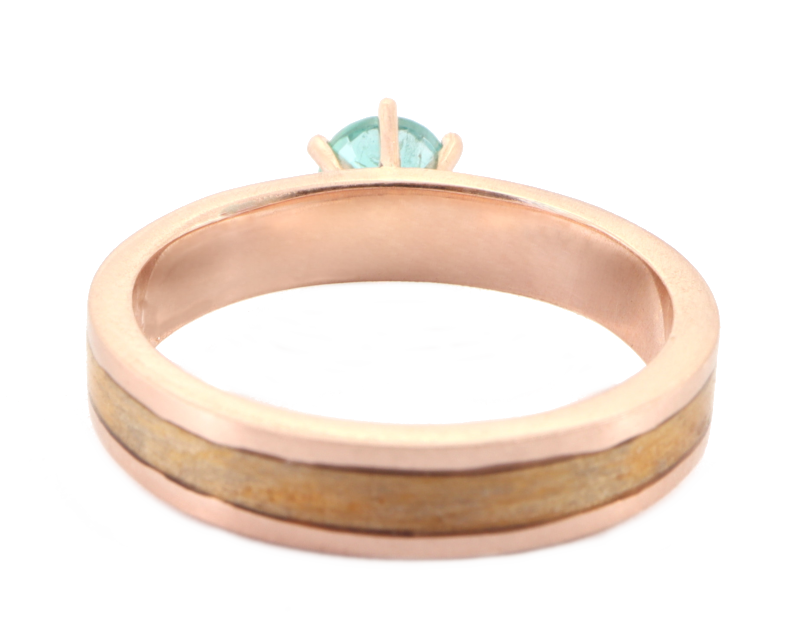 Rose Gold Emerald ring Showing Huon Pine Inlay